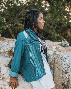 Side view of young woman looking away