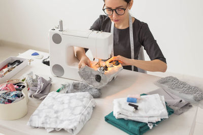 Portrait of a woman working on table