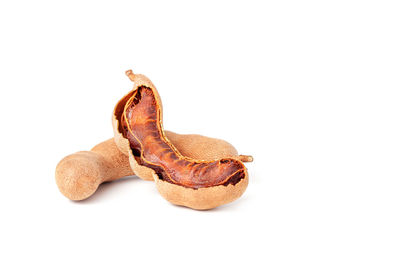 Close-up of dried fruits against white background