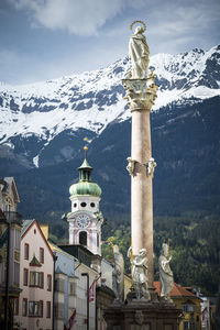 Statue of church against cloudy sky