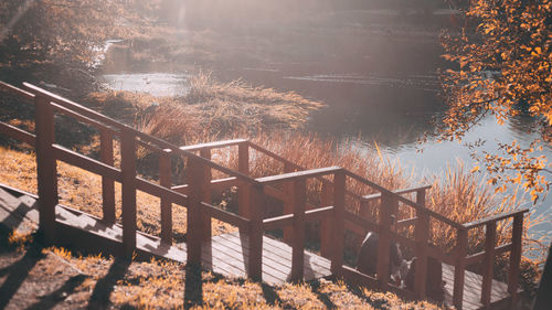 High angle view of railing by lake