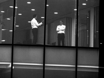 Reflection of people on glass