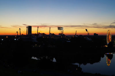 Scenic view of silhouette bridge against sky at sunset