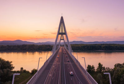 View of bridge over lake against sky during sunset