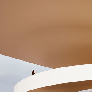 Low angle view of man against clear sky