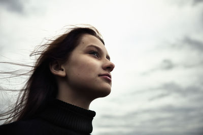 Close-up of young woman looking away