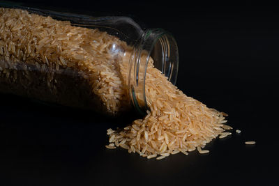 Close-up of food on table against black background