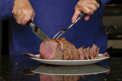 Close-up of man preparing food