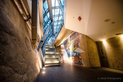 Man walking in corridor of building