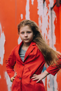 Teenager girl in red jacket