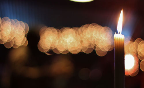 Close-up of illuminated burning candle