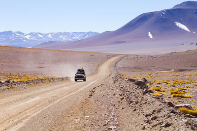 Car moving on dirt road