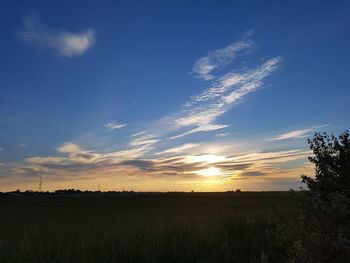 Scenic view of landscape at sunset