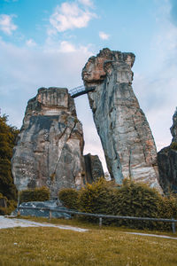 Low angle view of rock formation against sky