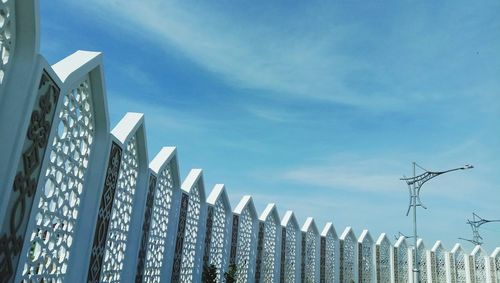 Low angle view of buildings against blue sky