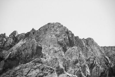 Low angle view of rock formation against clear sky