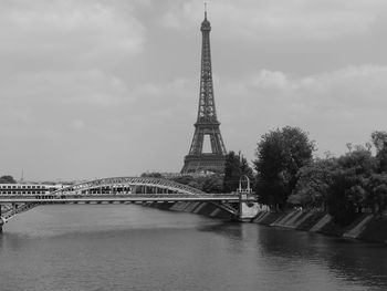 View of bridge over river against cloudy sky