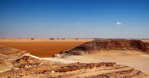 Scenic view of desert against clear sky