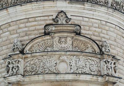 Low angle view of carvings on old building