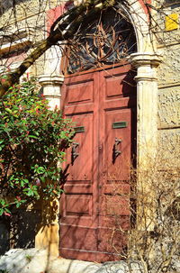 Low angle view of closed door and building