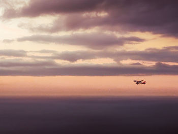 Scenic view of sea against orange sky