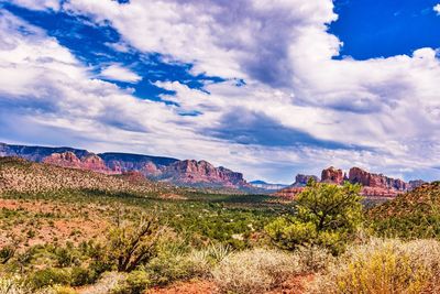 Panoramic shot of countryside landscape against cloudy sky