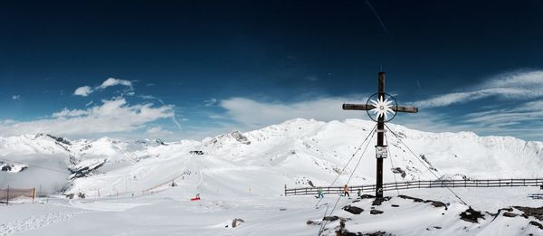 Scenic view of snow covered mountains against sky