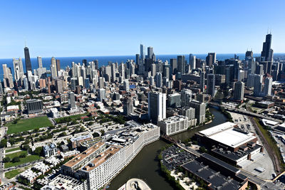 High angle view of modern buildings in city against sky