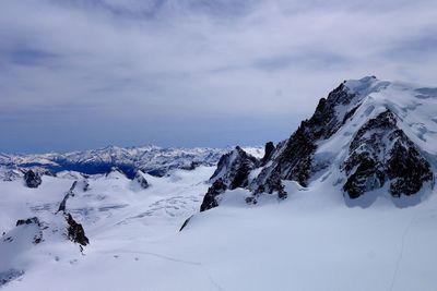 Snow covered mountains against sky