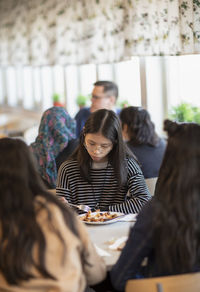 Girl eating lunch school canteen