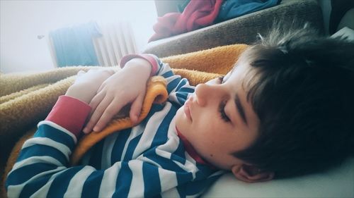 Close-up of baby sleeping at home