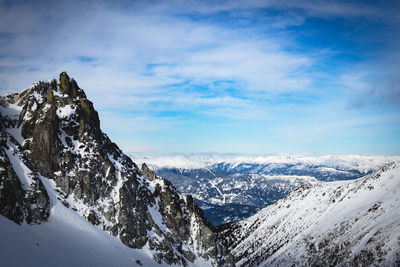 Scenic view of mountains against sky during winter