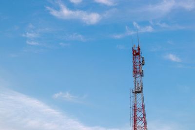 Low angle view of communications tower against sky