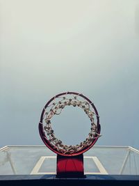 Low angle view of basketball hoop against sky