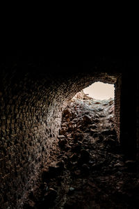 View of old wall through window