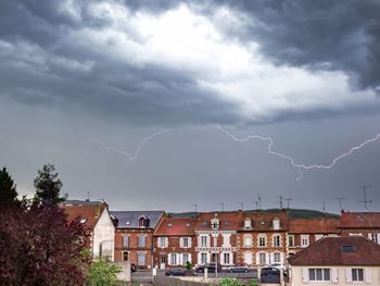 Lightning over buildings in city