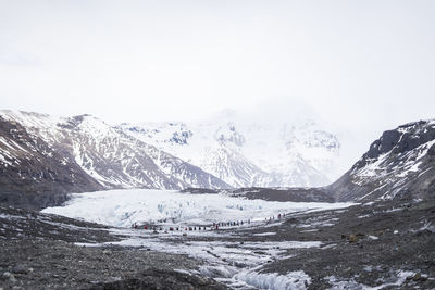 Scenic view of snowcapped mountains against clear sky