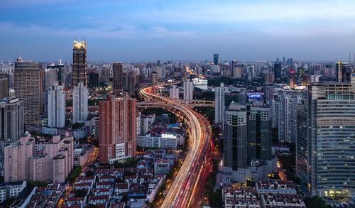 High angle view of shanghai against cloudy sky