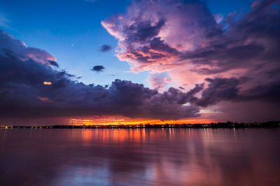 Scenic view of lake against romantic sky at sunset