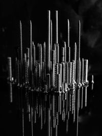 Close-up of metal chain against black background