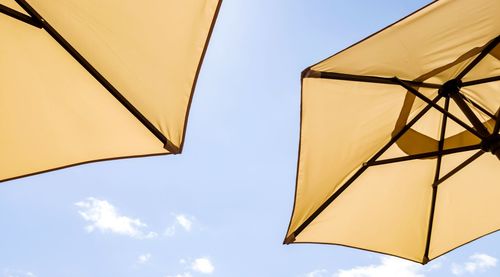 Low angle view of umbrella against sky