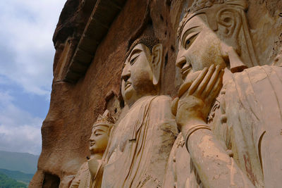 Low angle view of buddha statue