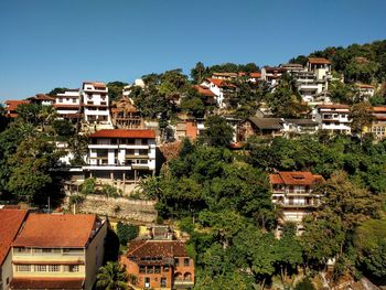 Exterior of houses in town against clear sky