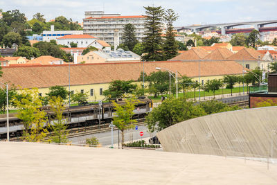 High angle view of buildings by street in city