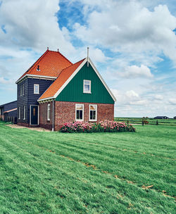 Colorful house in field on marken island in netherlands 