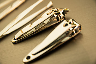 Close-up of nail clippers on table