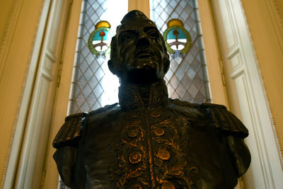 Low angle view of statue against building