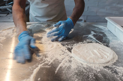 Midsection of man preparing food