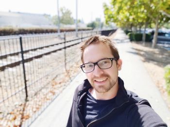 Portrait of smiling man at park