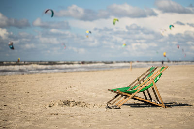 Empty deck chairs at beach